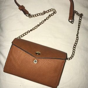 Small brown clutch with shoulder strap